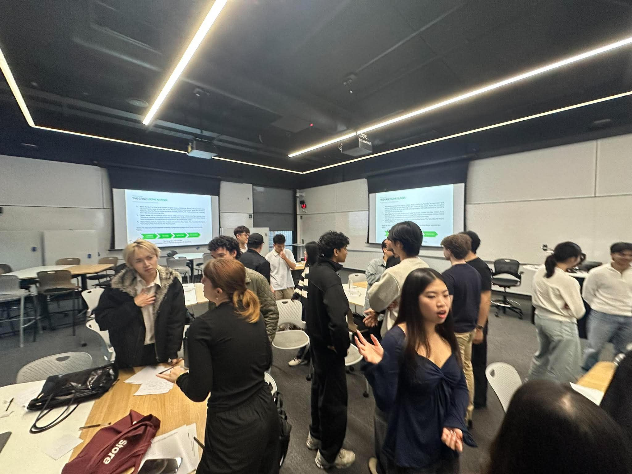 A 180DC UQ project team in a seminar room