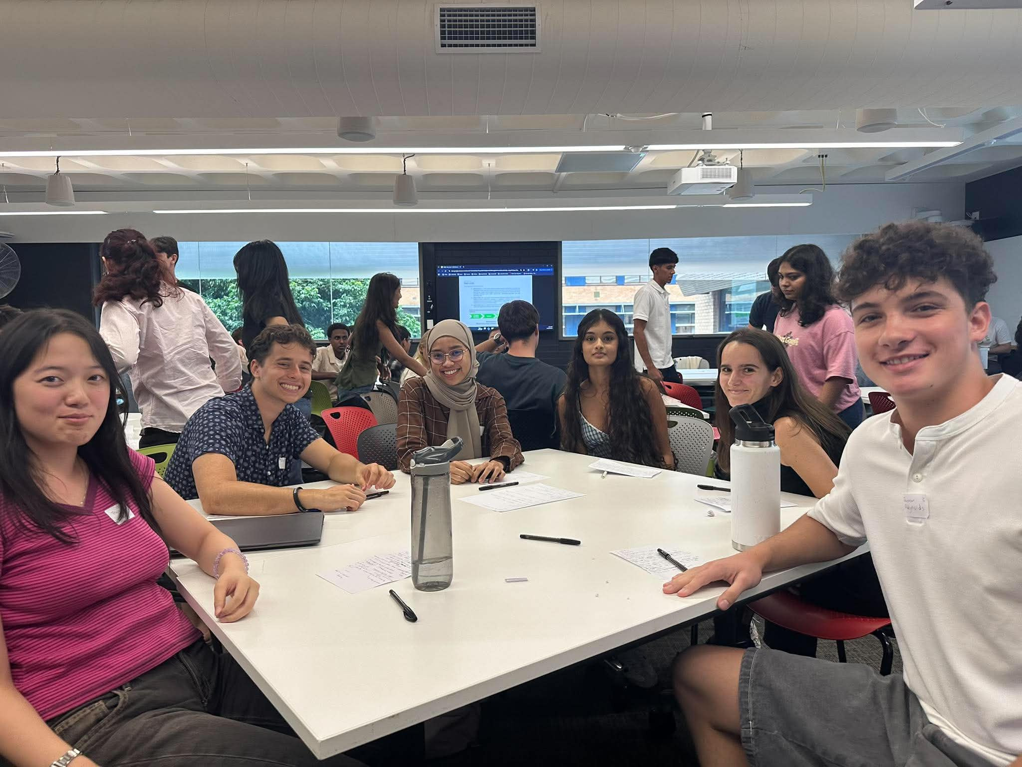 Student consultants working together around a table